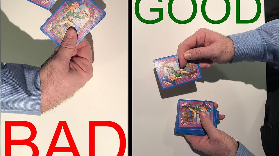 Hands dealing playing cards
