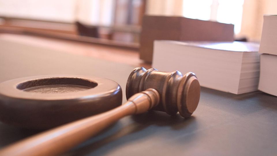 Gavel on a judge's bench in a courtroom